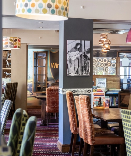 Interior dining area of a pub with a bar.