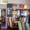 Interior dining area of a pub with a bar.