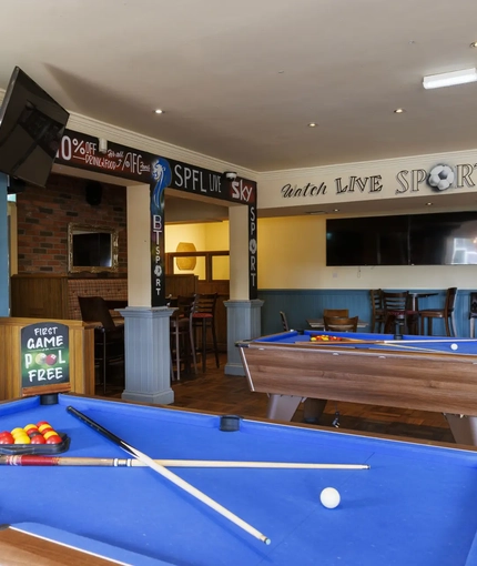 Interior shot of the pool tables and seating area