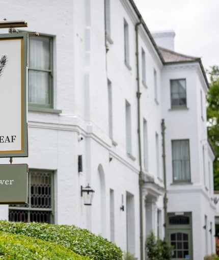 The hanging sign outside of the Wheatsheaf.