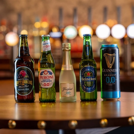 A selection of alcohol free free drinks on a wooden table of a pub