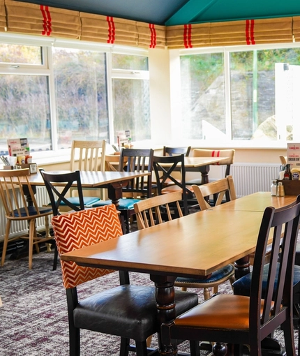 The interior restaurant and seating area with TV at the Pack Horse.
