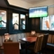 interior dining area of a pub with a TV