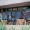 Exterior facade of a pub with a seating area.