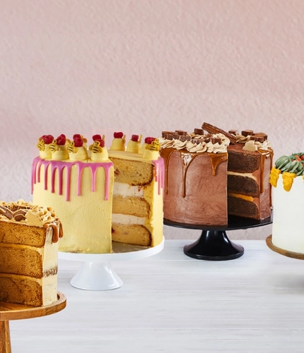 A variety of Farmhouse Inns cakes on cake stands.