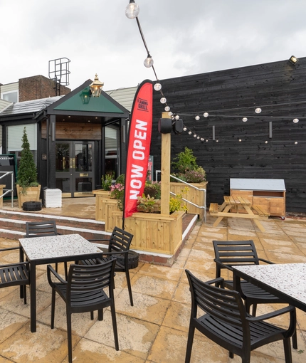 Part of the beer garden in front of the entrance of the Cocked Hat.