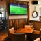 interior of the restaurant and seating area with TV