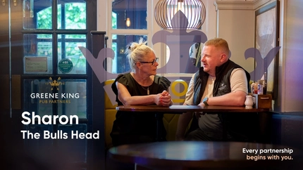 A video cover banner showing 2 people sat at a table, talking within the interior seating area for Pub Partners.