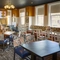 The interior restaurant seating area with TV at The Yacht.