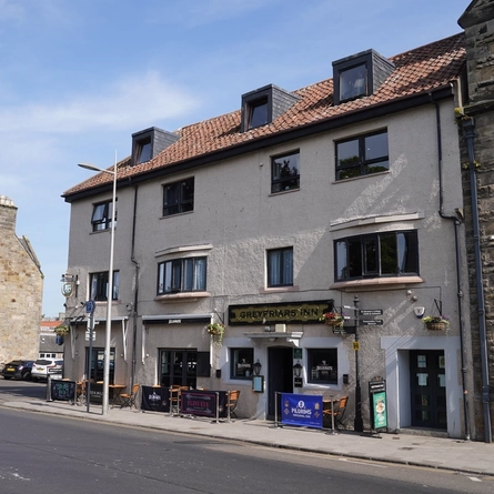 The exterior facade and outdoor seating area at The Greyfriars Hotel.