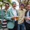 An image of 4 friends stood within the beer garden area with drinks during The Boat Race event at The Crabtree.