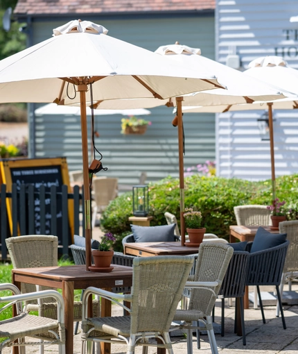 Some beer garden tables outside of the Three Horse Shoes.