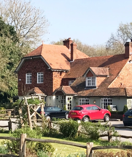 exterior facade and car park of a pub