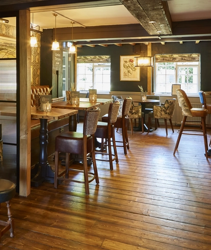 The interior restaurant seating area of The Fox & Hounds in Wimborne.
