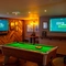 The interior games area at the Counting House, with a pool table, restaurant seating, and TVs on the walls.