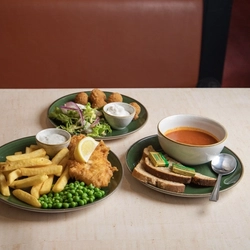 A starter of soup, a main of gammon, egg and chips and a side of breaded mushrooms served at Farmhouse Inns.