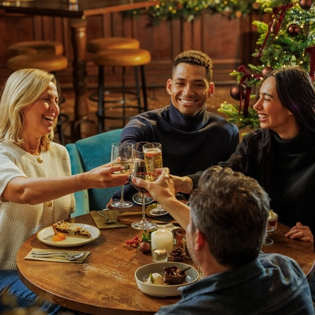 People enjoying festive desserts and drinks