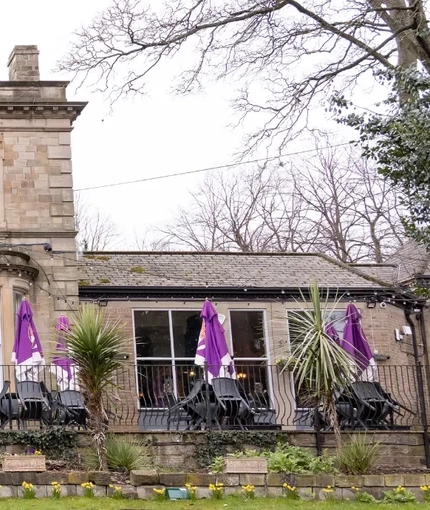 The exterior facade with seating area at the Brentwood.