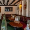 The interior restaurant seating area with TV, at Ye Olde Mitre in Barnet.