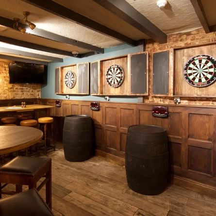 Metro - Williams Ale and Cider House (Whitechapel) - Three dartboards on the wall and an area for seating