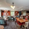 Interior dining area of a pub with a TV.