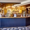 The bar, interior seating area and TV at The Good Intent in Hornchurch.