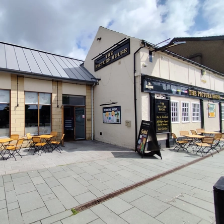 The exterior of the venue and outdoor seating area at The Picture House.