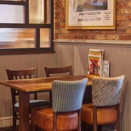 An image of one of the tables within the interior restaurant seating area at The Farmhouse.