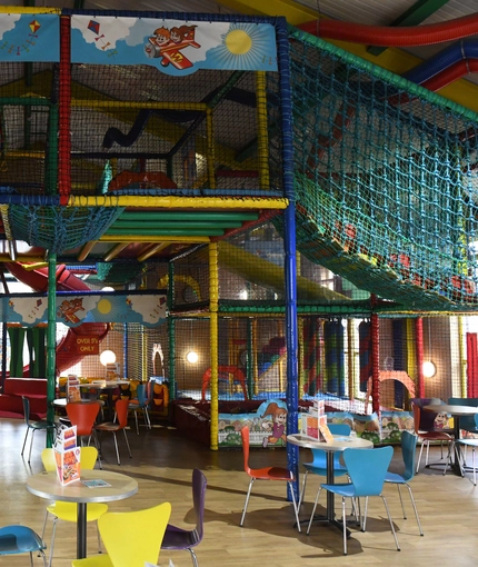 Interior kids dining and play area of a pub.