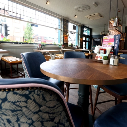An interior shot of the bar, seating area & decor at The Palmeira in Hove.