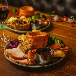 A Christmas day main of a Turkey dinner served in the restaurant at a Community Social venue.