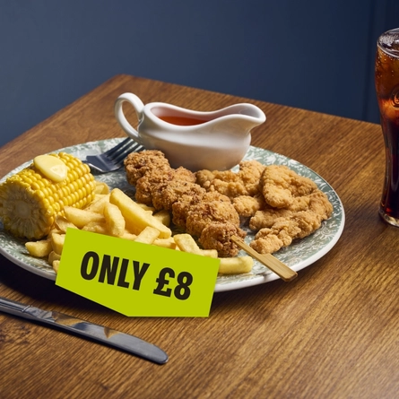 A banner showing a plated Chick n Mix dish with chips, corn on the cob and jug of sauce sat on a table with the wording "Only £8" to advertise dishes at Cornerstone venues.