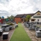 exterior beer garden of a pub with a seating area and a play area