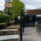 The exterior beer garden and seating area with venue signage for the Hem Heath.