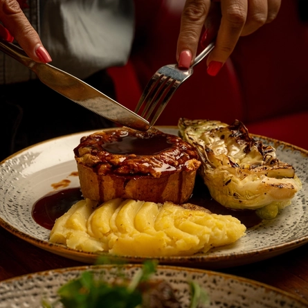 A main of beef and raclette pie served at the Three Tuns.