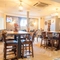 The interior restaurant and seating area with TV at the Poachers 