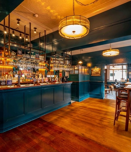 The bar and interior restaurant seating area of the Lucas Arms in London.