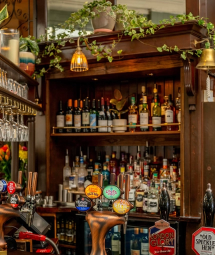 A close up view of the bar and beer taps at The Crown.