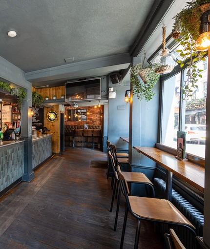 Interior restaurant and seating area with bar