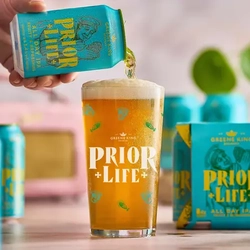 A hand pouring a pint of Prior Life.