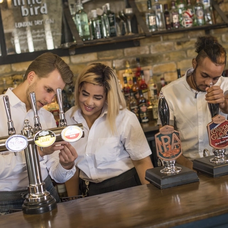 Team members at the bar