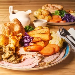 A plate of carvery meat and roast vegetables