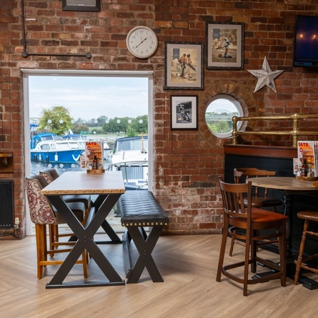 The interior restaurant seating area with TV, at The Stanley Ferry. 