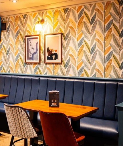 The interior seating area with TV on the wall at the Armstrongs.
