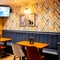 The interior seating area with TV on the wall at the Armstrongs.