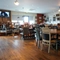 interior of the restaurant with seating area with TV's