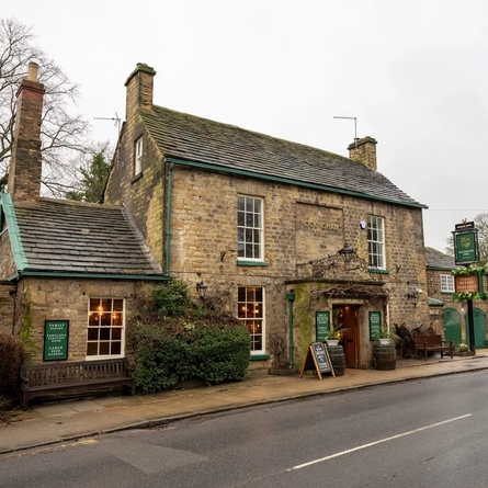 The exterior and entrance of The Rockingham Arms.