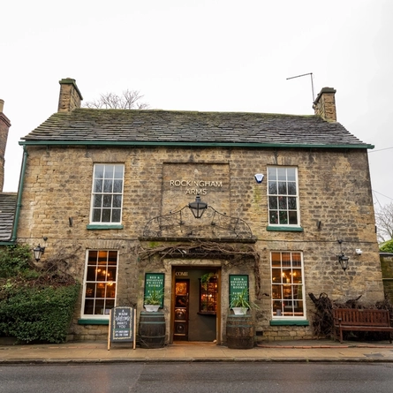 The exterior and entrance of The Rockingham Arms.