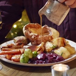A 466x699 Boxing Day Food Advertising Image showing a turkey Roast Dinner available at Chef & Brewer Venues.