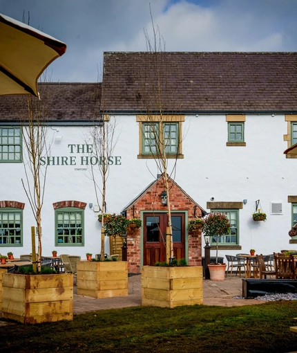 The beer garden and exterior of The Shire Horse.